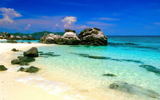 Beach rock formation blue sky free wallpaper for desktop - medium preview image