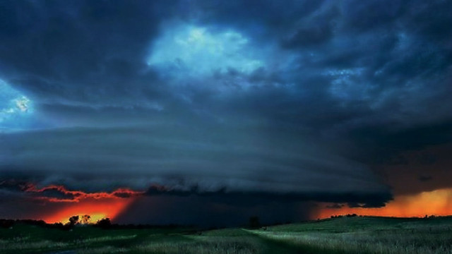 Storm cloud sunset grassy field free wallpaper for desktop - medium preview image