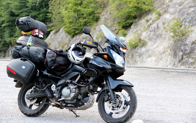 Motorcycle helmet parked road cliff free wallpaper for desktop - medium preview image