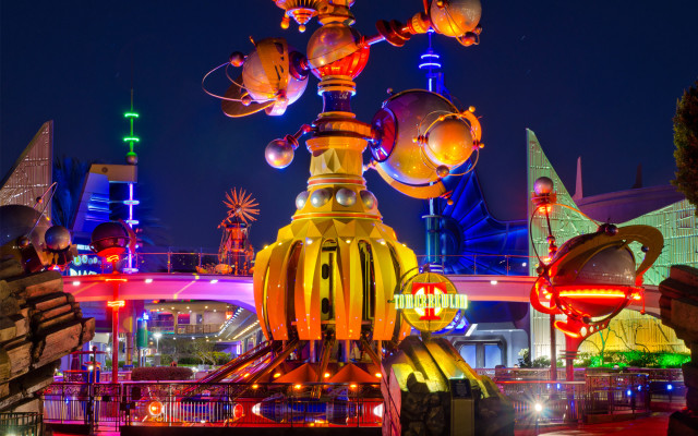 Mickey mouse statue building nighttime free wallpaper for desktop - medium preview image