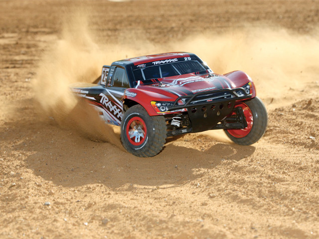Red truck driving dirt sand free wallpaper for desktop - medium preview image
