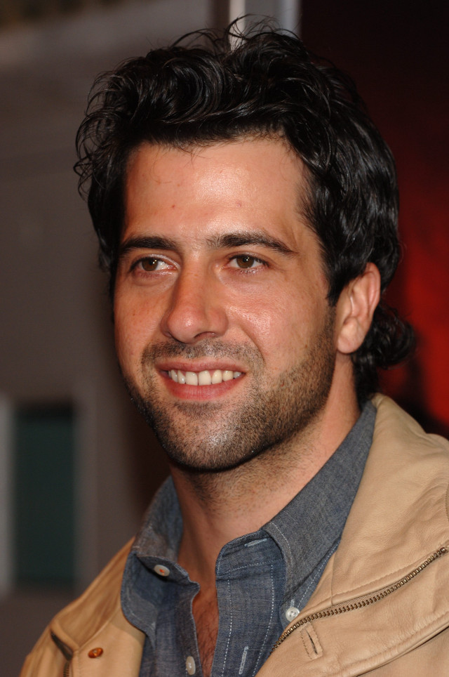 Bearded man smiling red background #2 free wallpaper for mobile - medium preview image