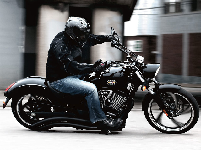 Man riding motorcycle street building free wallpaper for desktop - medium preview image
