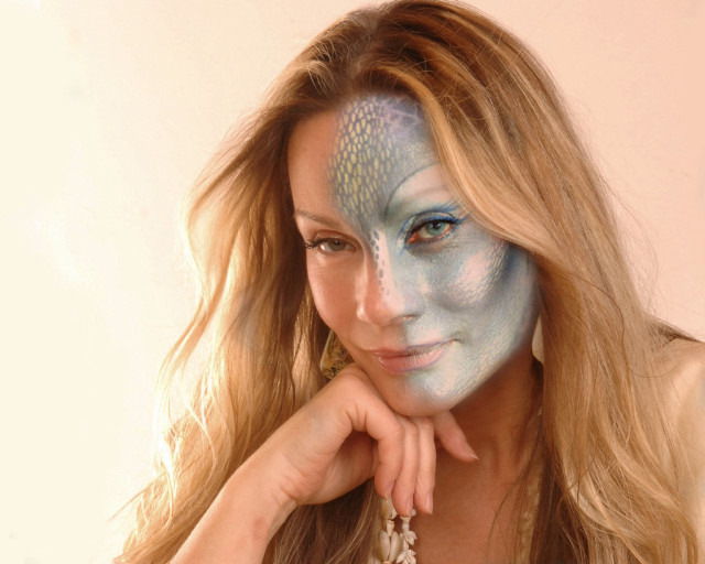 Blue face paint woman posing free wallpaper for desktop - medium preview image