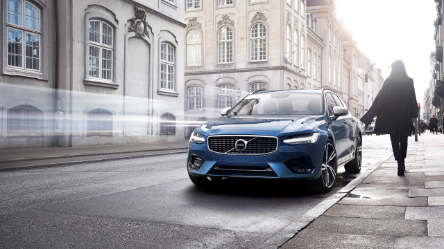 Blue volvo car parked woman free wallpaper for desktop - medium preview image