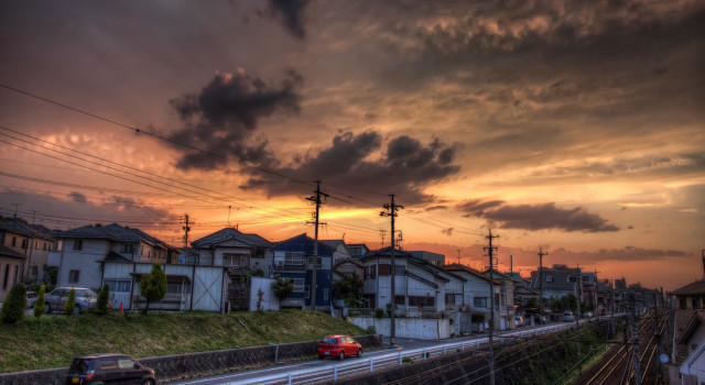Red car street buildings sunset free wallpaper for desktop - medium preview image