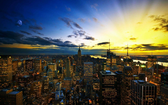 City skyline yellow blue sunset free wallpaper for desktop - medium preview image