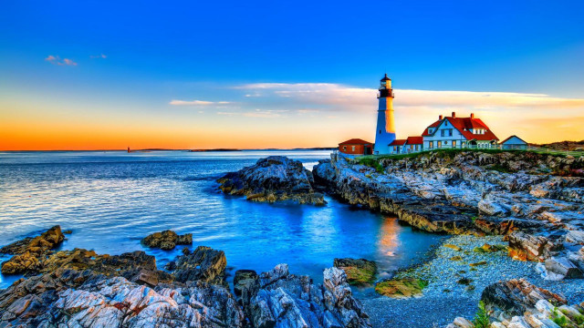 Lighthouse rocky shore sunset water free wallpaper for desktop - medium preview image