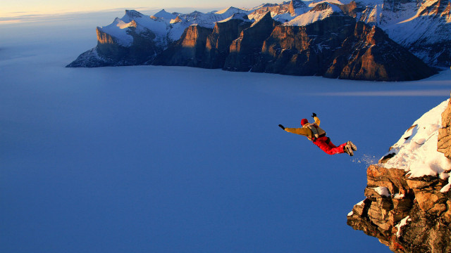 Man jumping cliff water snowboard free wallpaper for desktop - medium preview image