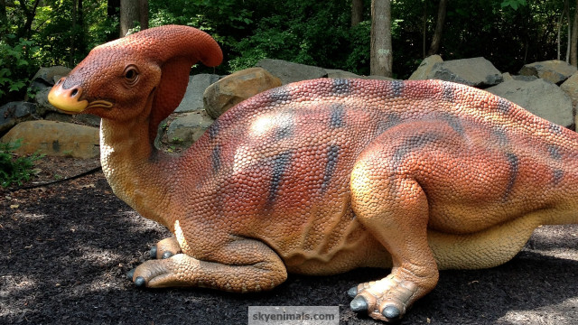 Dinosaur statue gravel field forest free wallpaper for desktop - medium preview image