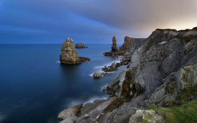 Rocky cliff water large rock free wallpaper for desktop - medium preview image