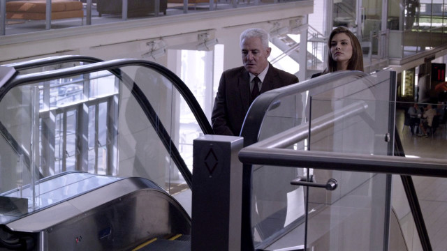 Man woman walking escalator building free wallpaper for desktop - medium preview image