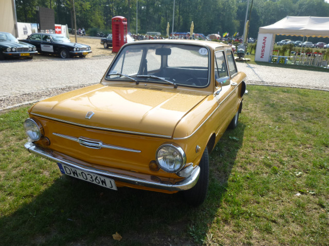 Yellow car grassy area fire free wallpaper for desktop - medium preview image