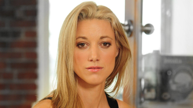 Blonde woman black top serious free wallpaper for desktop - medium preview image