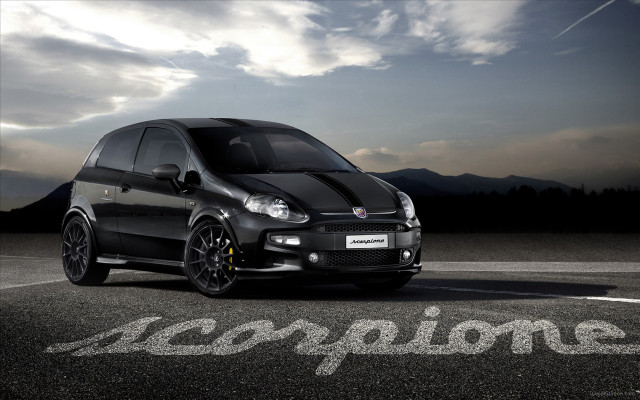 Small black car parked road free wallpaper for desktop - medium preview image
