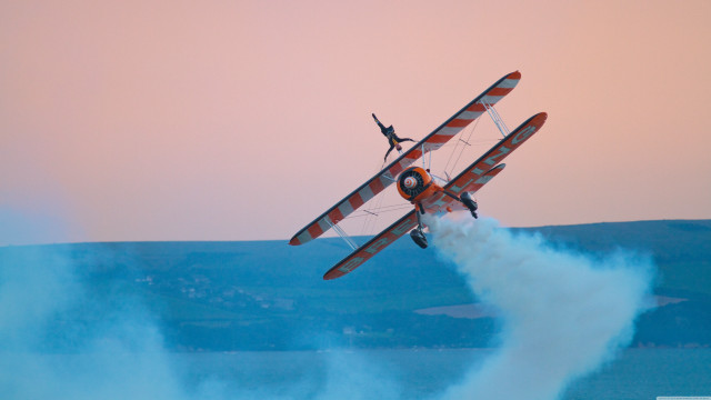 Biplane flying water person back free wallpaper for desktop - medium preview image