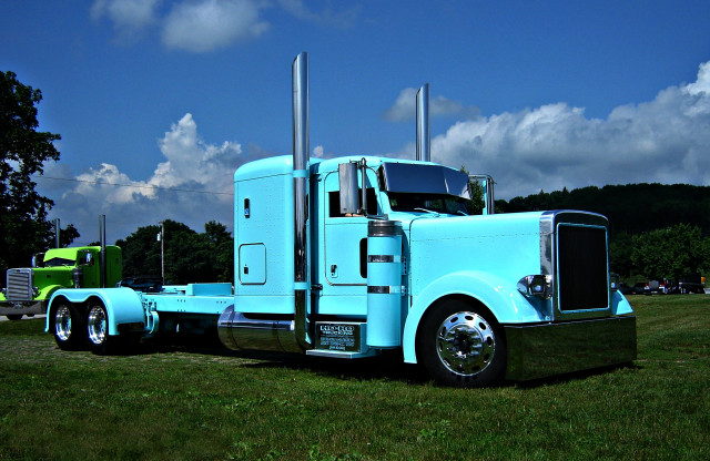 Blue semi truck parked field free wallpaper for desktop - medium preview image