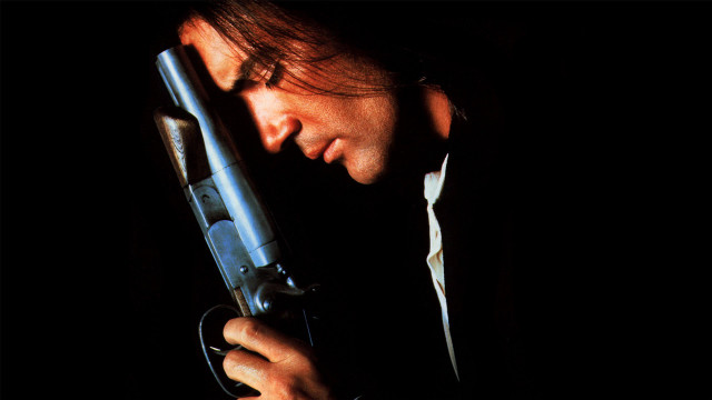 Man holding gun looking down free wallpaper for desktop - medium preview image