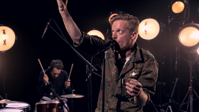 Military man singing microphone drums free wallpaper for desktop - medium preview image