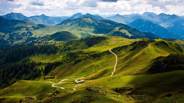 Winding road lush green mountains free wallpaper for desktop - medium preview image