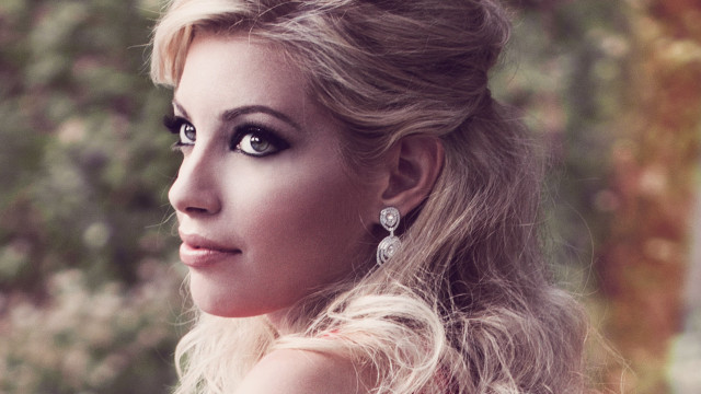 Blonde woman serious look grey free wallpaper for desktop - medium preview image