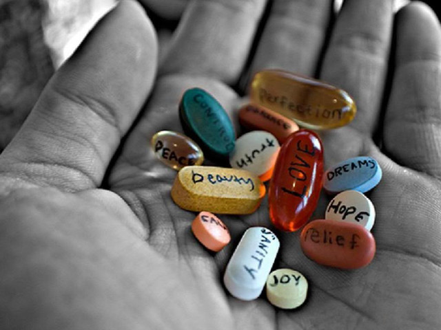 Hand holding pills love hope free wallpaper for desktop - medium preview image