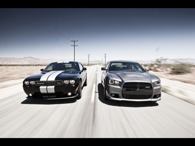 Two cars driving road desert free wallpaper for desktop - medium preview image