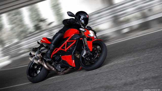 Red motorcycle driving street blurry free wallpaper for desktop - medium preview image