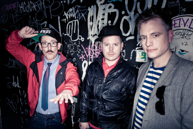 Three men graffiti wall standing free wallpaper for desktop - medium preview image