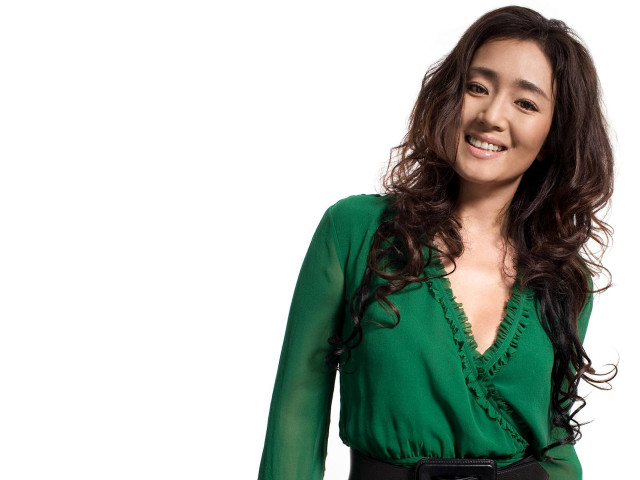 Woman green top smiling portrait free wallpaper for desktop - medium preview image