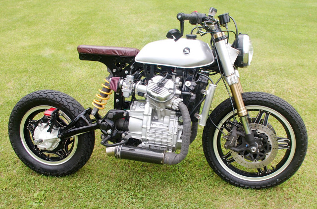 Motorcycle parked green field clock free wallpaper for desktop - medium preview image