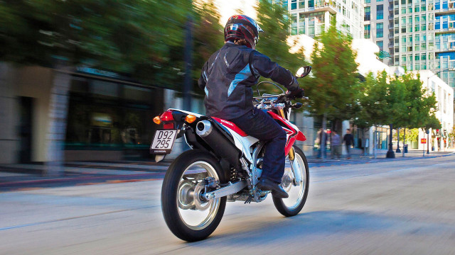 Man motorcycle street tall buildings #2 free wallpaper for desktop - medium preview image