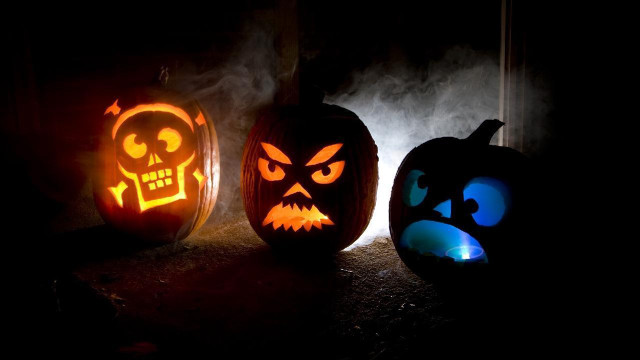 Three carved pumpkins glowing faces free wallpaper for desktop - medium preview image