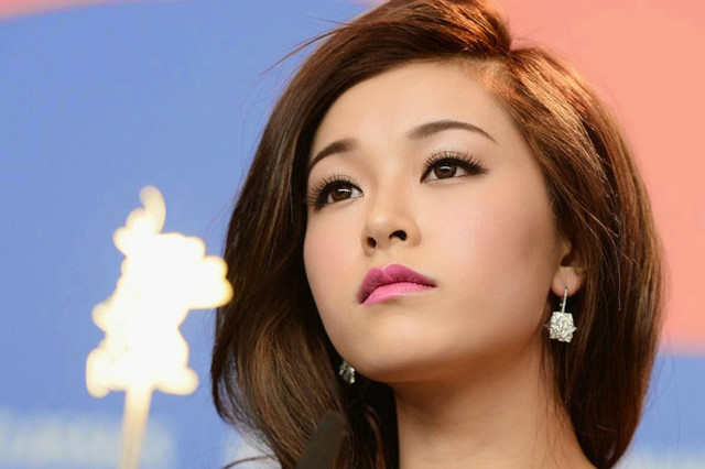 Woman pink lipstick earrings looking free wallpaper for desktop - medium preview image