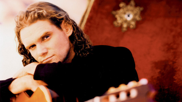 Man long hair chair guitar free wallpaper for desktop - medium preview image