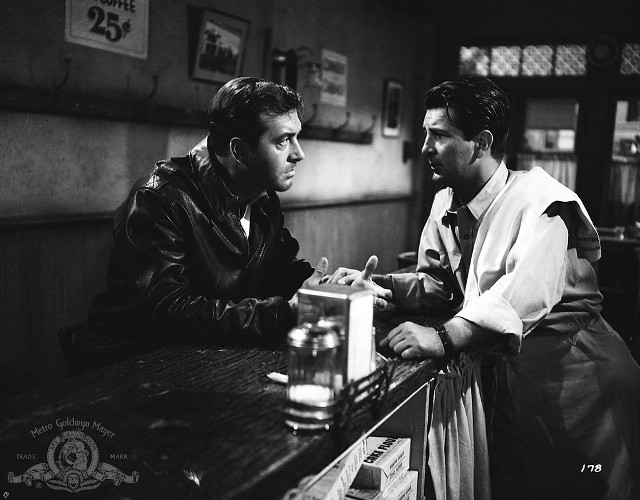 Two men sitting bar talking free wallpaper for desktop - medium preview image