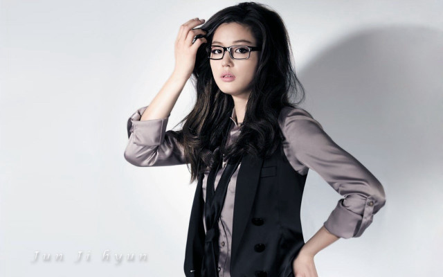 Woman suit glasses posing hands free wallpaper for desktop - medium preview image