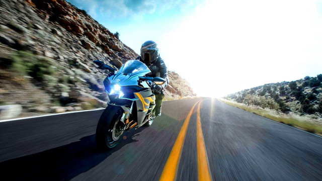 Motorcycle ride mountain road sky free wallpaper for desktop - medium preview image