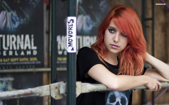 Red haired woman fence serious free wallpaper for desktop - medium preview image