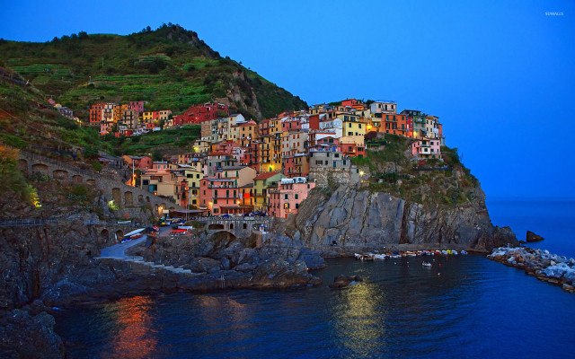 Small village cliff water night free wallpaper for desktop - medium preview image