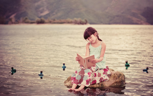 Girl sitting rock reading book free wallpaper for desktop - medium preview image