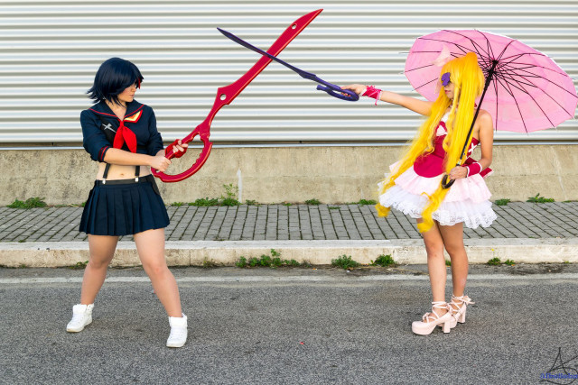 Two women costumes umbrellas street free wallpaper for desktop - medium preview image