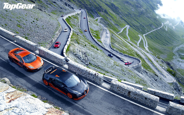 Orange sports cars winding road free wallpaper for desktop - medium preview image