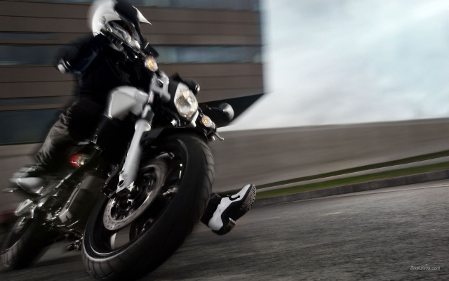 Man motorcycle street tall building free wallpaper for desktop - medium preview image