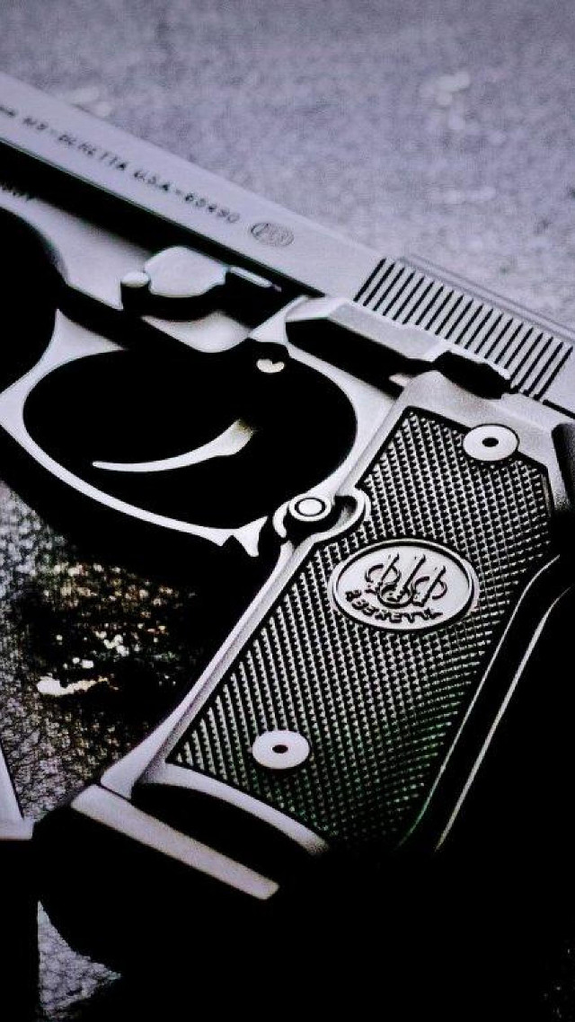 Gun closeup table black white free wallpaper for mobile - medium preview image