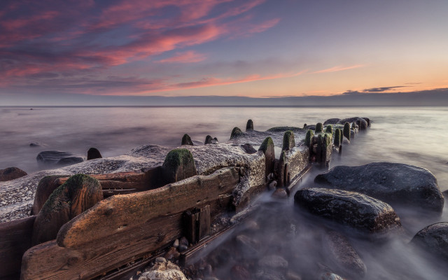 Sunset rocky beach pier water free wallpaper for desktop - medium preview image