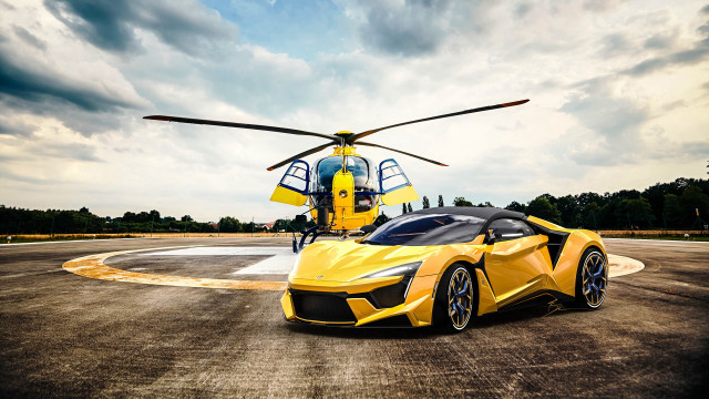 Yellow sports car helicopter cloudy free wallpaper for desktop - medium preview image