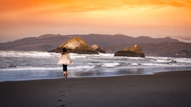 Beach woman sunset mountain ocean free wallpaper for desktop - medium preview image