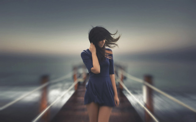Woman pier ocean blowing hair free wallpaper for desktop - medium preview image