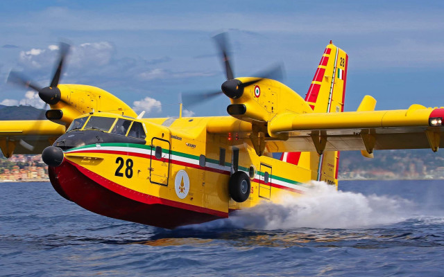 Yellow airplane ocean city boat free wallpaper for desktop - medium preview image